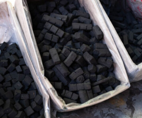 Shisha coal, charcoal pieces for water pipes closeup